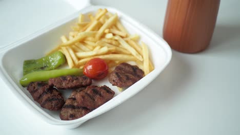 kufte with fries and vegetables