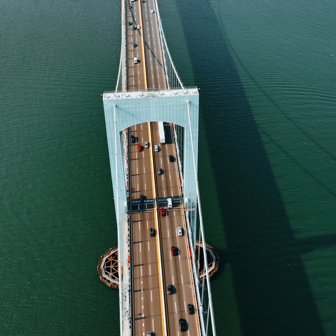 Sight of the beautiful Throgs Neck Bridge. Drone footage above the bridge over the East River on sunny day