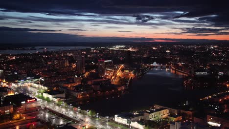 night city aerial view with river and bridge