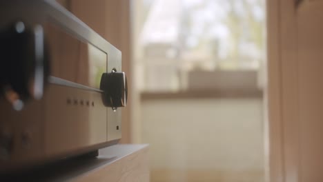 adjusting the hifi system and turning the volume up.