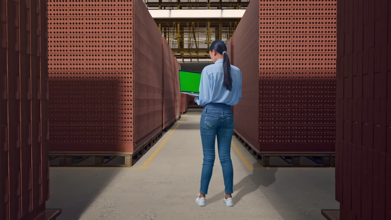 Woman inspecting brick inventory in a warehouse