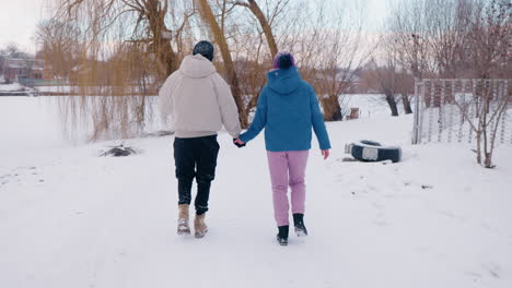 couple walking in the snow