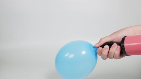 a balloon is inflated and then bursts dramatically