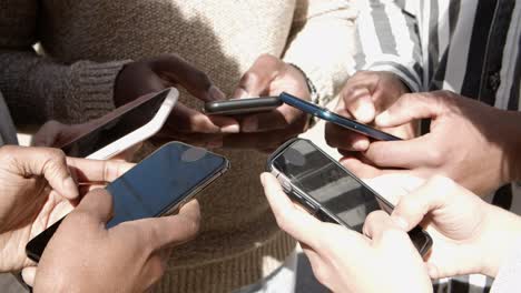 high angle view of young people using smartphones