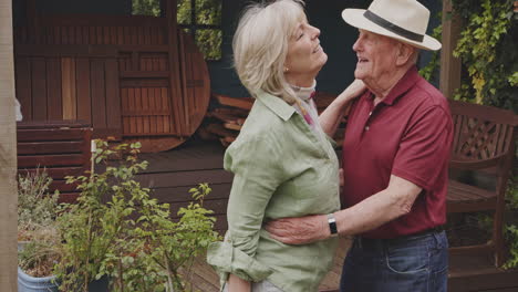 senior couple embracing in their garden