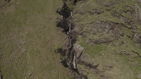 Flight-away-backwards-from-a-tiny-waterfall