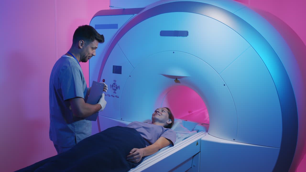 Doctor Talking to Patient during MRI Procedure