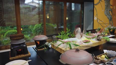 beautiful ryokan in japan with full kaiseki banquet set with snapper sashimi