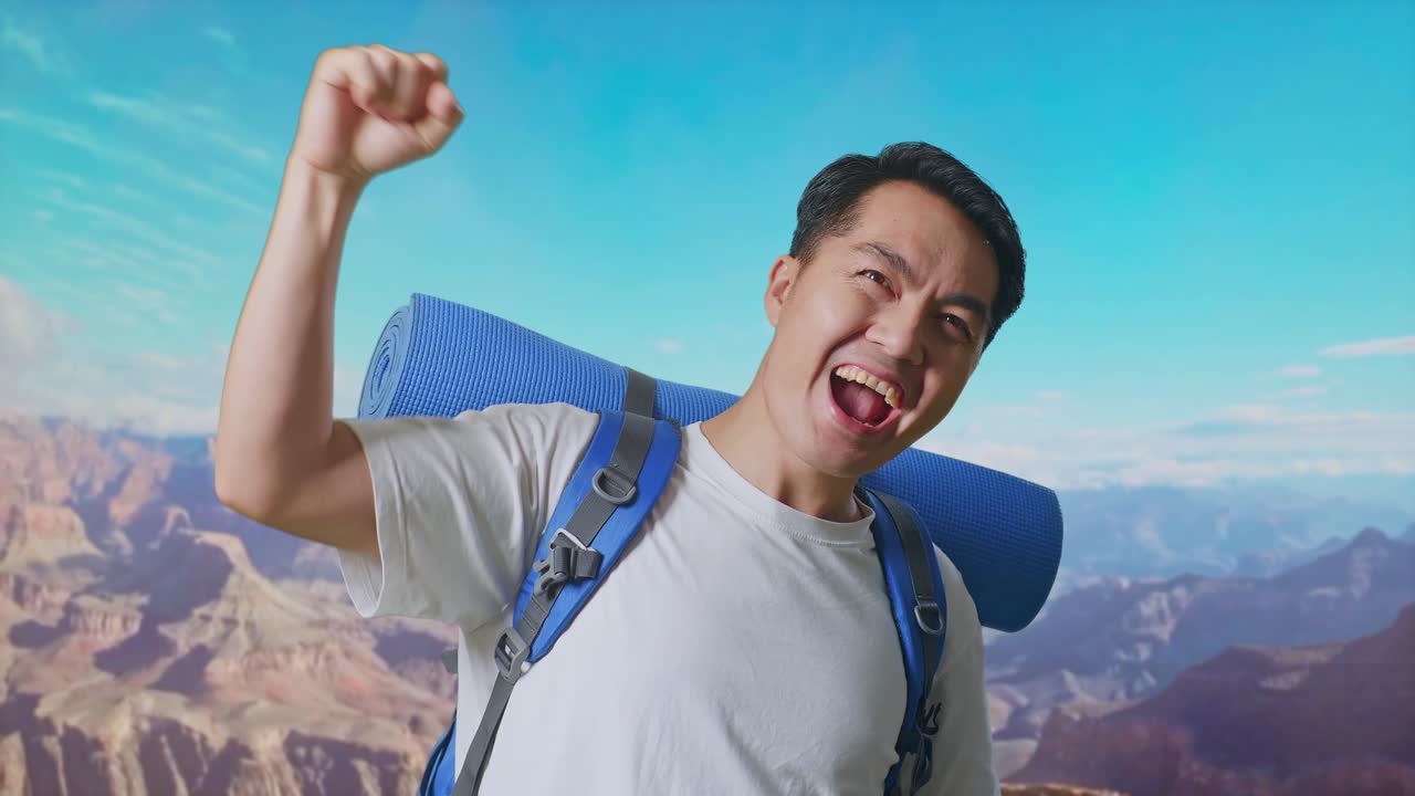 Close Up Of Asian Male Hiker With Mountaineering Backpack Screaming Goal Celebrating The Success While Traveling At The Top Of Mountain