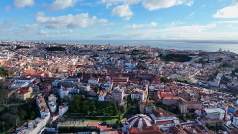 drone shot flying over lisbon city