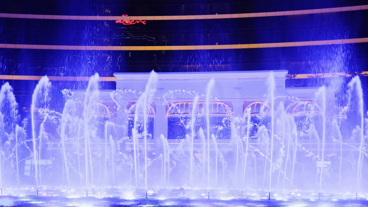 Mesmerizing Night Fountain Display with Colorful Lights and Fire