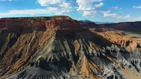 Aerial-view-approaching-rock-formations-of-the-Grand-canyon,-sunny-day-in-USA