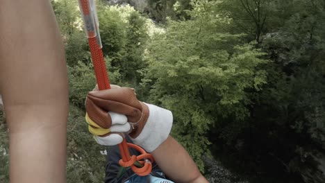 Point-of-view-from-a-man-slacklining-on-a-mountain-going-through-trees