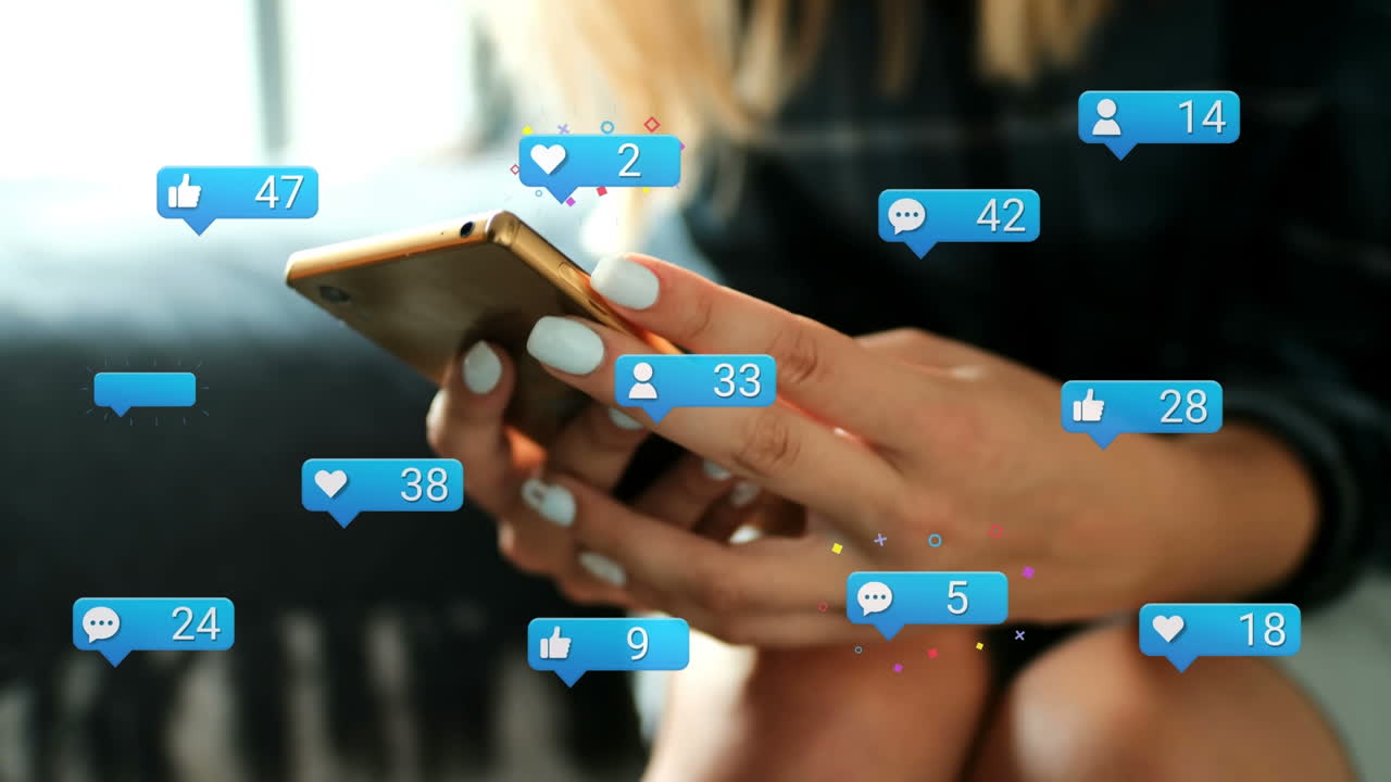 Animation of social media reactions over hands of caucasian woman using smartphone