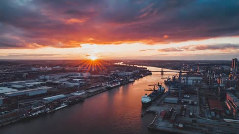 aerial view of an industrial port city at sunset