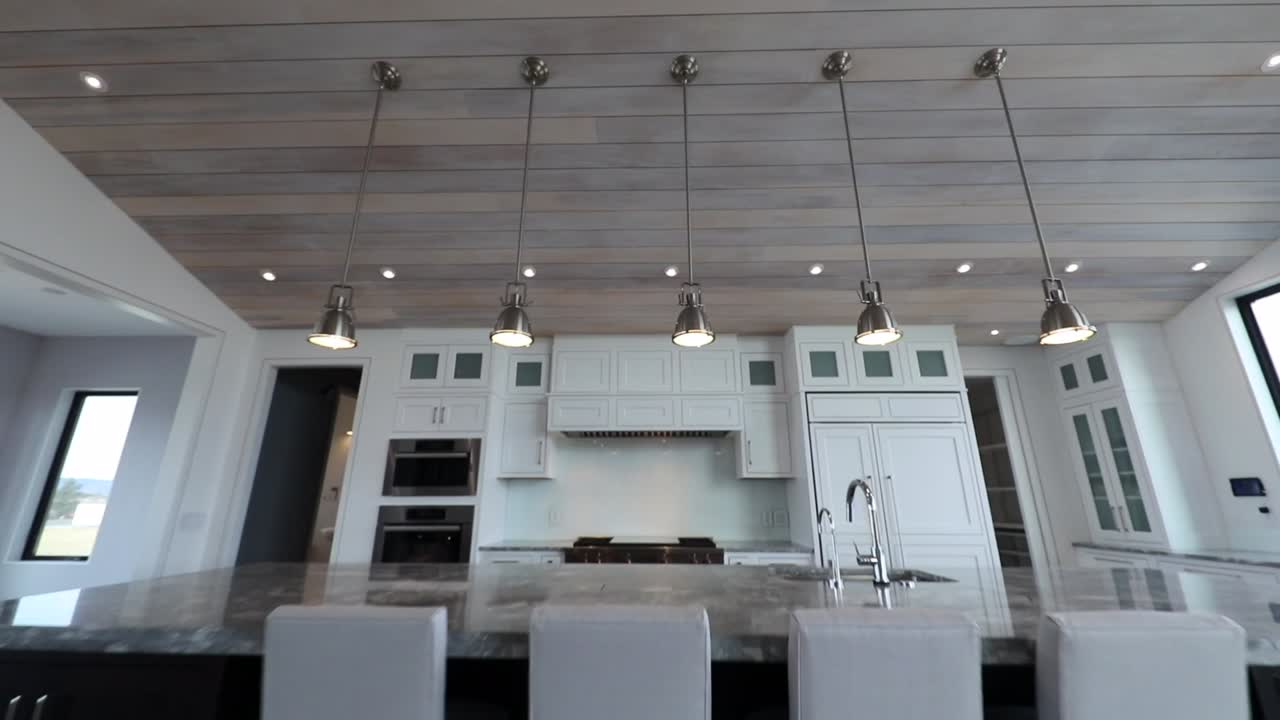 interior of modern - contemporary kitchen and living room. light, bright, white finishes