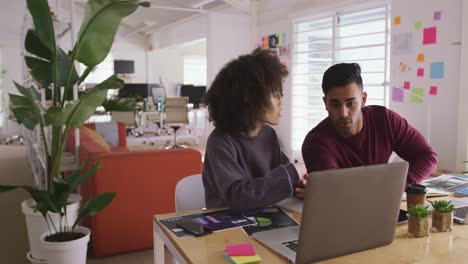 Two-colleagues-working-in-creative-office