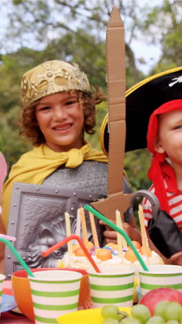 group of kids in various costumes having breakfast