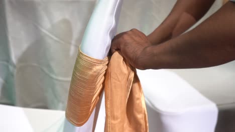 covers-the-chair-with-a-cloth-closeup-view