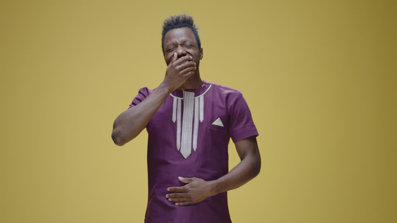 Man Yawning and Bored, African Style Clothing