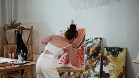 young woman dancing in the art room