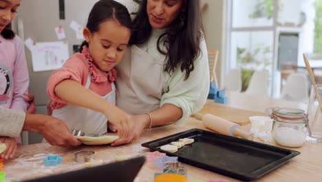 grandma and mother teaching children baking