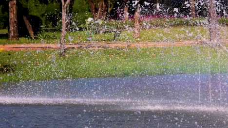 colorful rainbow forms in fountain spray