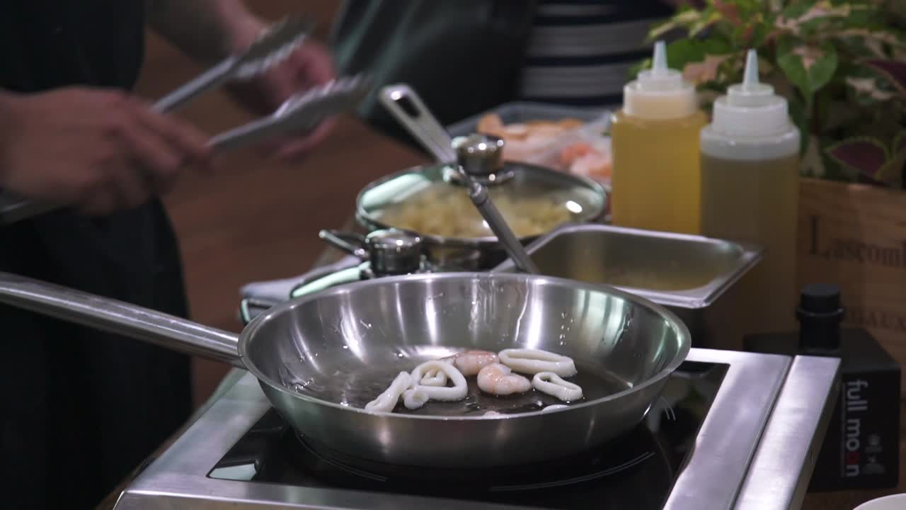 Chef cooking food in a open kitchen
