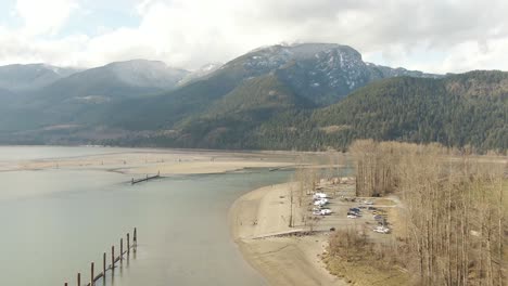 aerial view of a river in the valley surrounded by canadian mountain landscape