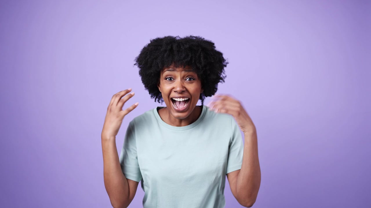 African American Woman Expressing Surprise and Joy
