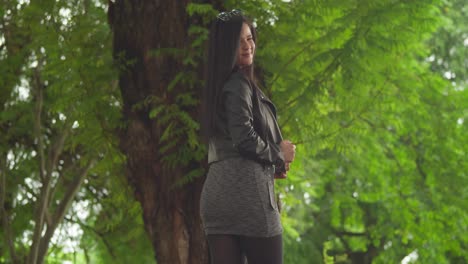 in a jacket and boots, a woman is having a great time at a vibrant caribbean park