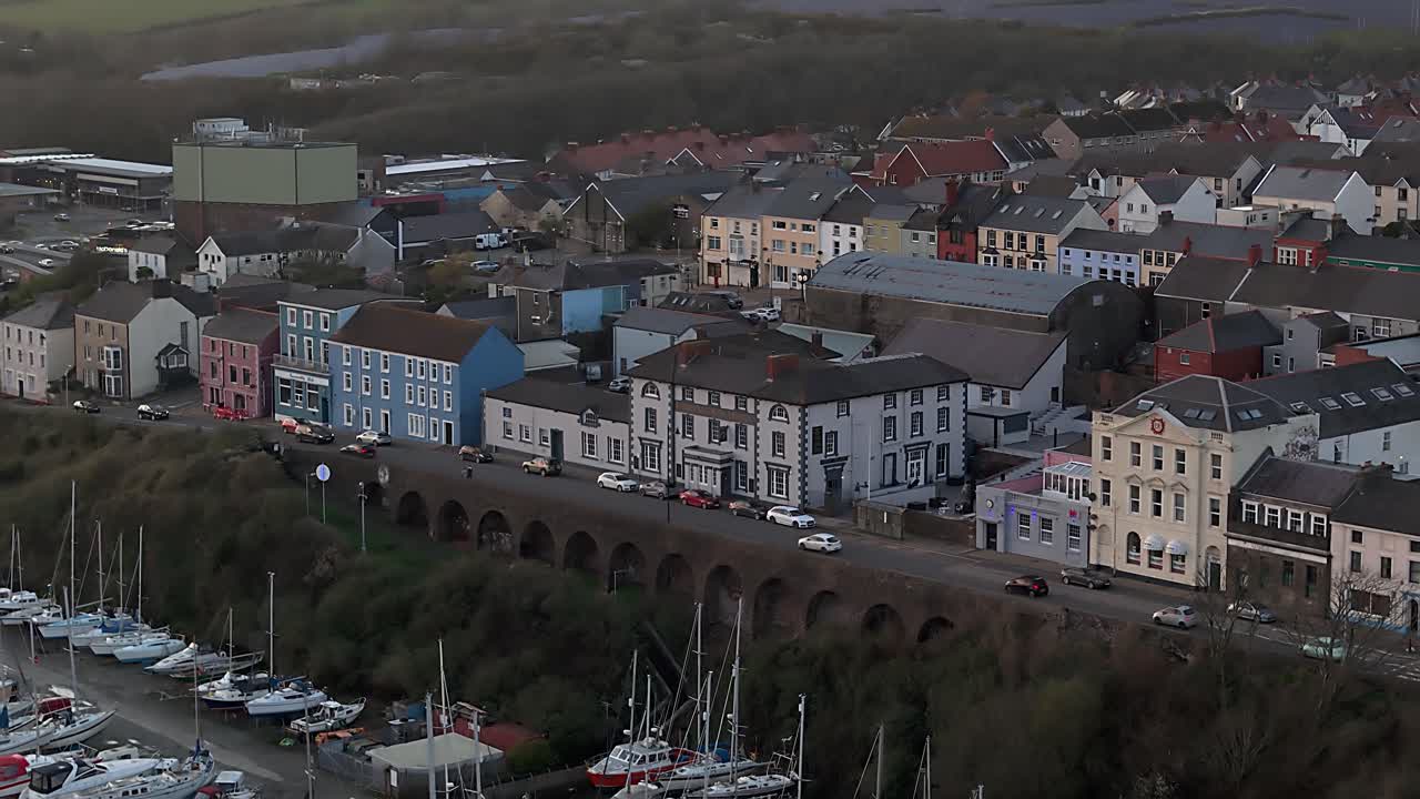 Milford waterfront in pembrokeshire, showing colorful buildings and boats, aerial view