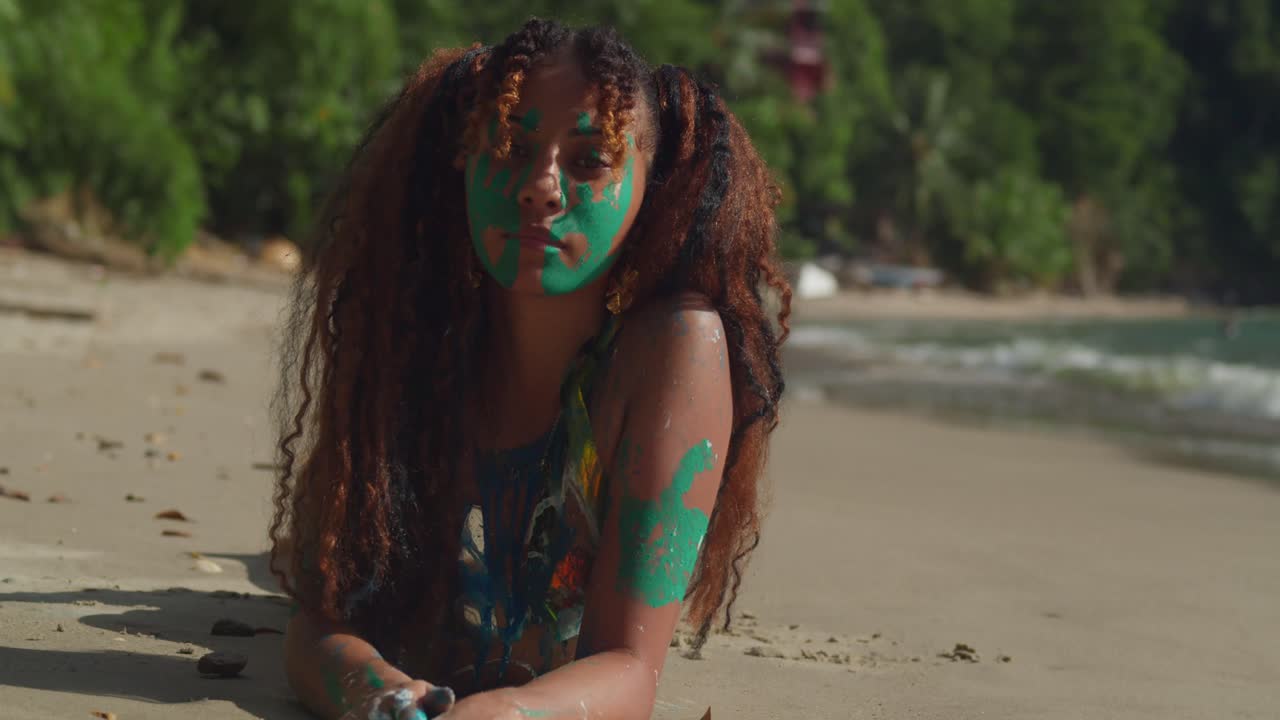 Woman with Green Body Paint on Tropical Beach