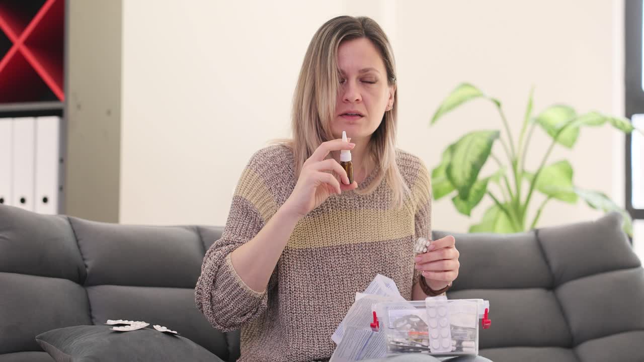 Woman Using Nasal Spray for Cold