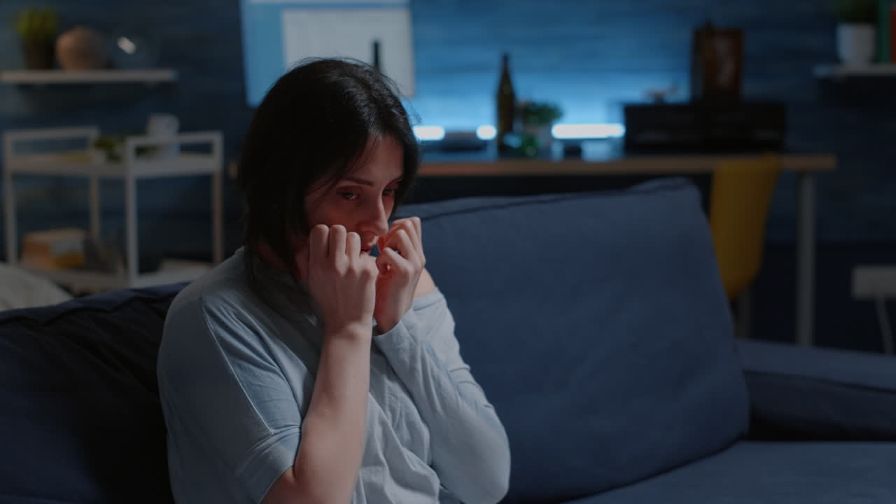 Depressed, scared, shocked, lonely woman dropping phone