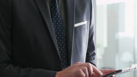 businessman using digital tablet in office 4k