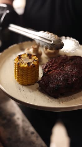 grilled steak with corn and mushrooms