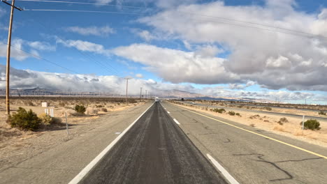 driving through the mojave desert - hyper lapse from the perspective of the rear window of a car on the highway