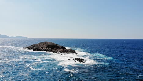 Rock-Landscape-In-The-Middle-Of-The-Blue-Sea,-Jerusalem-Beach,-Erisos,-Greece---aerial-static