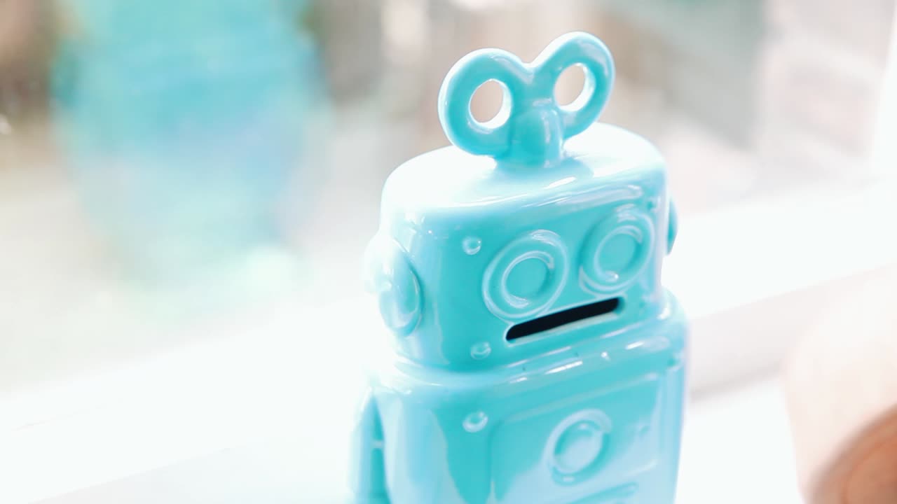 Blue robot roy in front of window