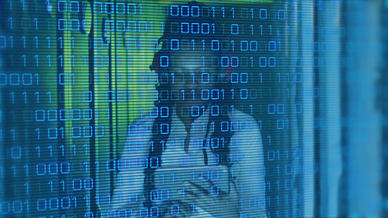 Animation of binary codes, african american woman with headphone using digital tablet in server room