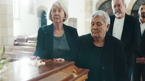 funeral, iglesia y mujeres con la mano en el ataúd