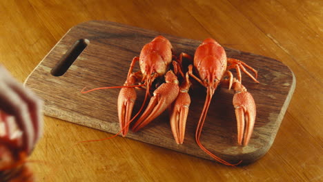 crayfish on a wooden cutting board