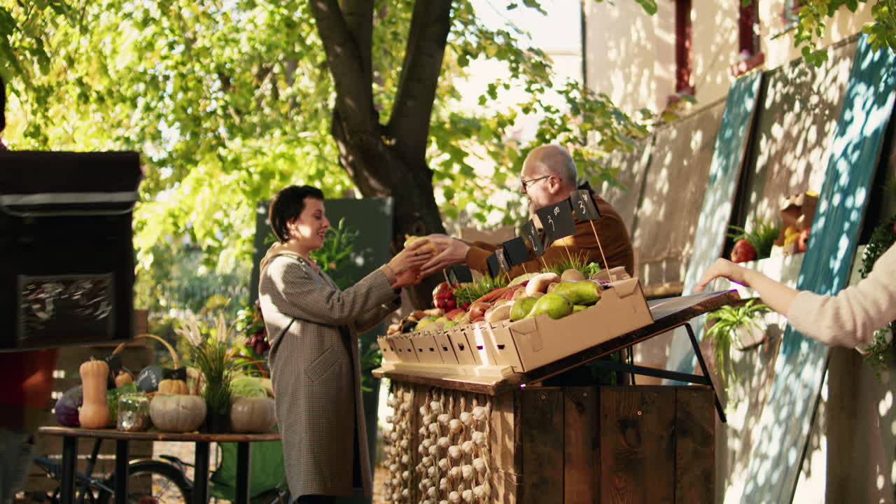 People buying vegetables at an outdoor market