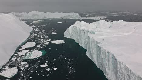 drone over sea and ice of ilulissat icefjord