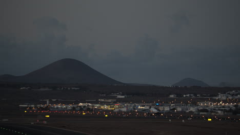 Plane-leaving-scenic-evening-town