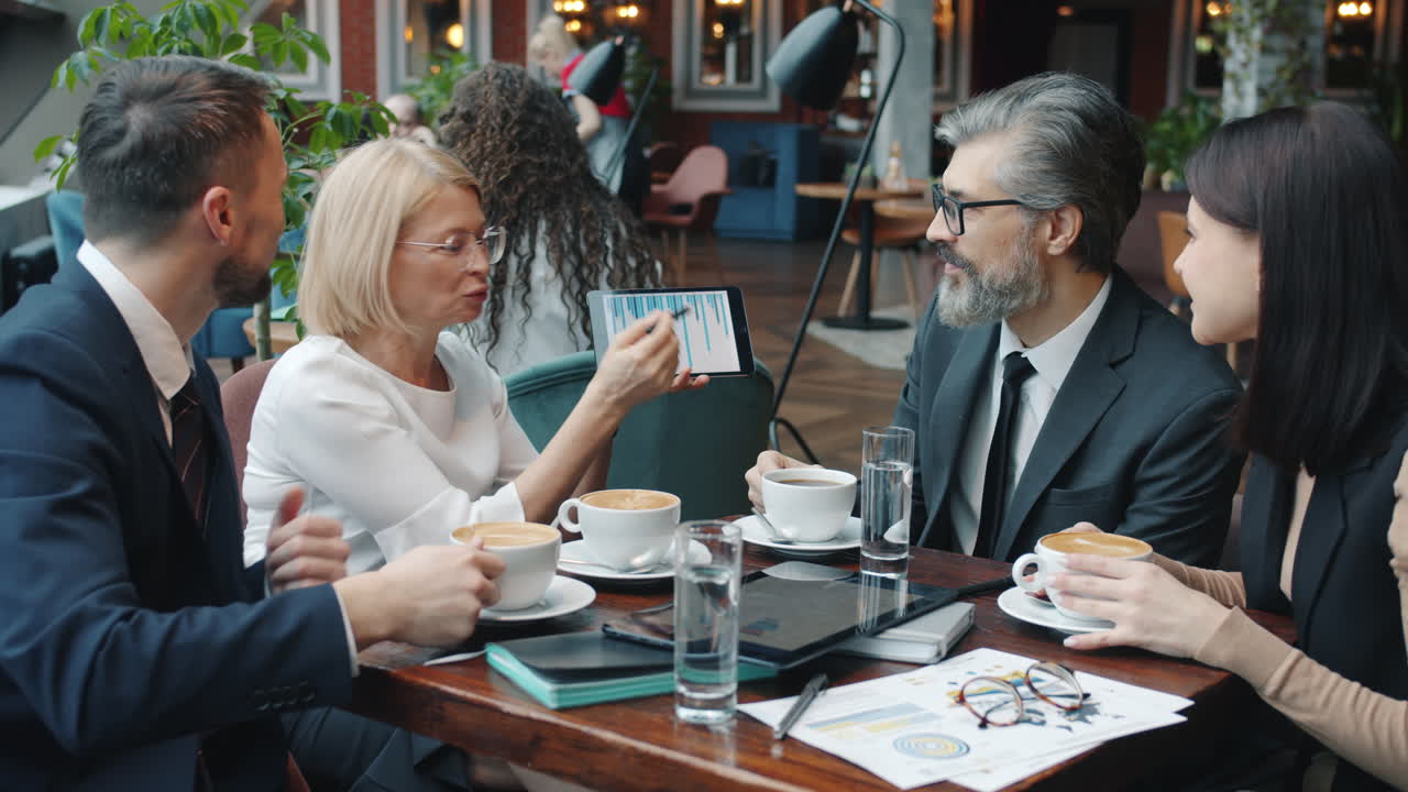 Business Team Meeting in a Coffee Shop
