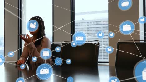 Animation-of-network-of-connections-with-icons-over-businesswoman-using-smartphone