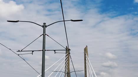 hd looking up going across tilikum crossing bridge in portland oregon with mostly cloudy sky take six