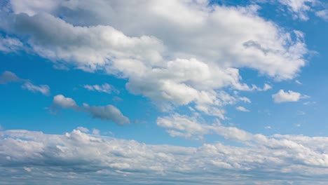 beautiful blue sky with clouds background timelapse loop. white rolling, fast motion time lapse clouds in horizon. 4k cloudscape loop time lapse